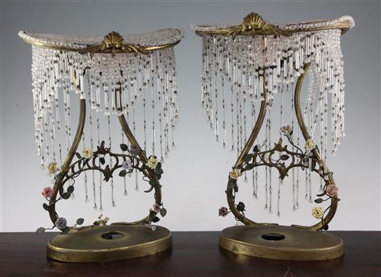 A pair of French gilt metal porcelain and crystal mounted niche lamps, early 20th century, 34.5cm.